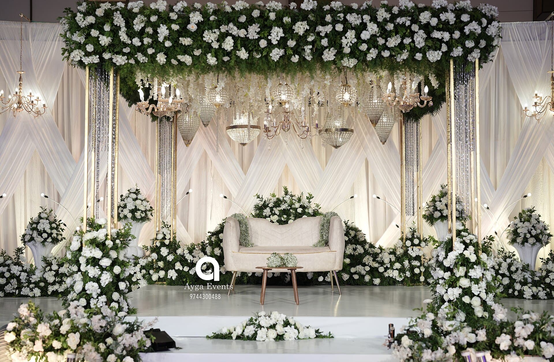 White floral wedding stage set in Kerala